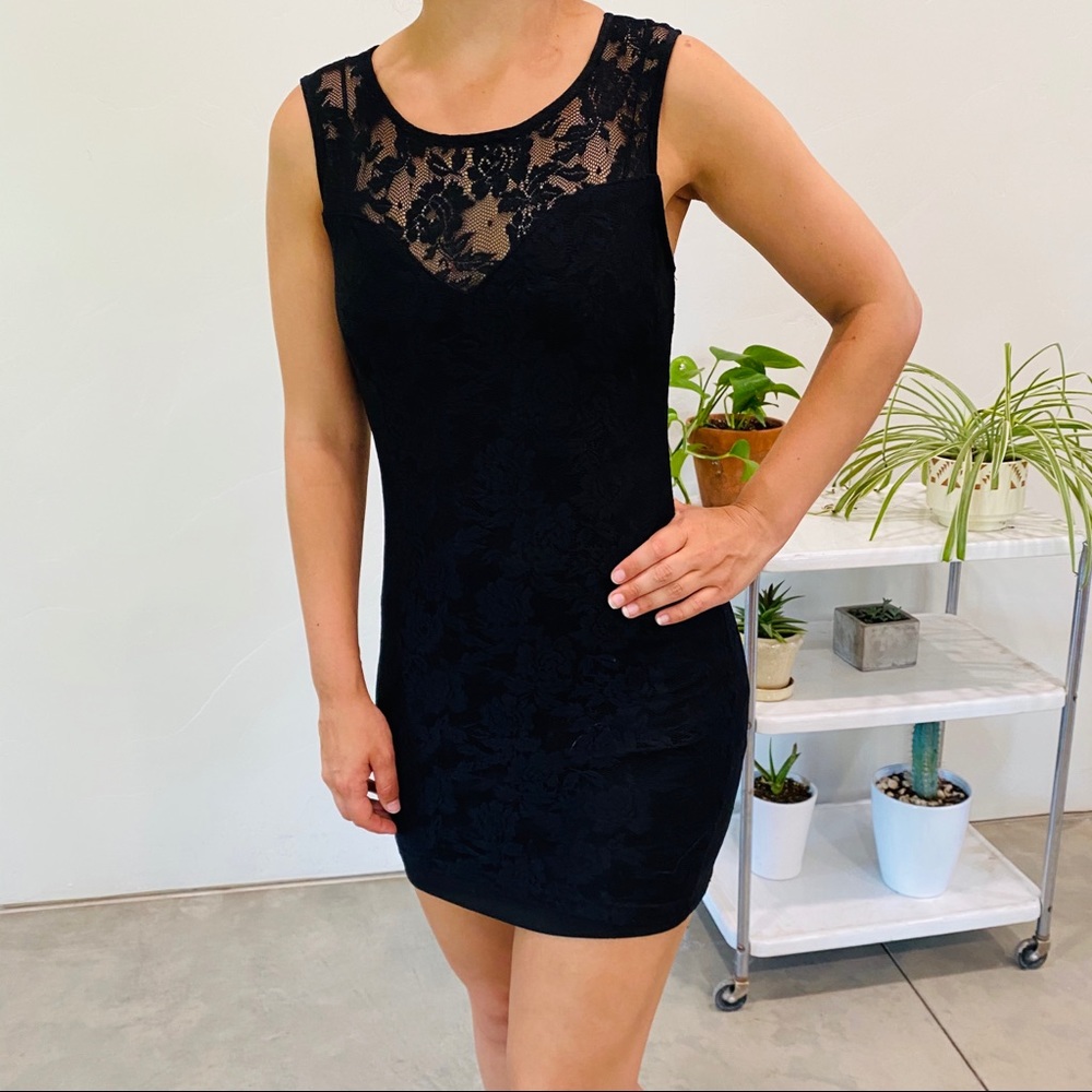 Form fitting black lace dress